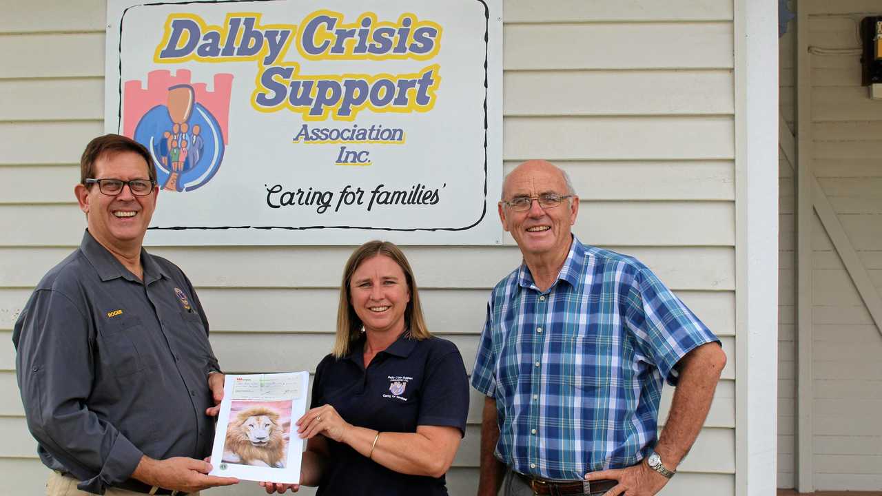 HELPING HAND: Past Lions president Roger Henderson presents a donation to family support worker Irene Tanks and committee member Paul Moys. Picture: Shannon Hardy