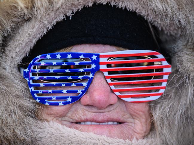 A woman in U.S.A novelty glasses poses for a photograph ahead of the Men’s Halfpipe Qualification Run 1 snowboarding competition at Phoenix Park on day four of the PyeongChang Winter Olympics on February 13, 2018 in Pyeongchang-gun, South Korea. Picture: Getty Images