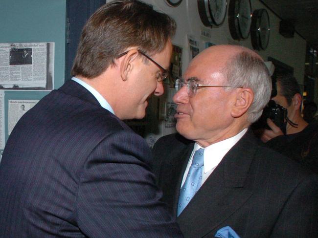 NEWS: Prime Minister John Howard (R) and Opposition Leader Mark Latham cross paths in the ABC radio studios in Sydney, during campaign for Federal election. Pic John Feder