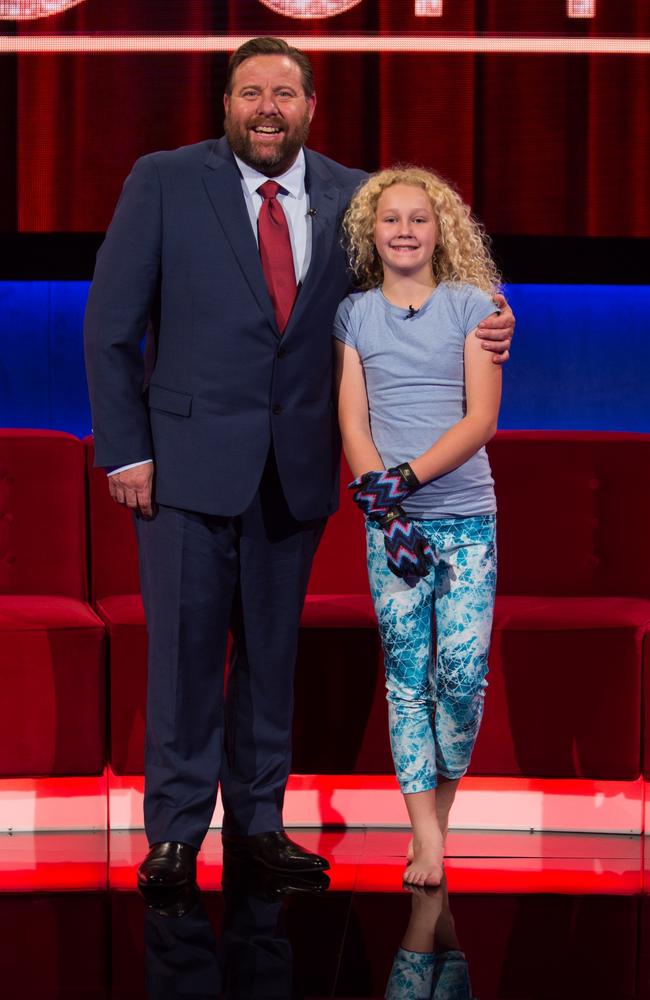 Giddy up...Little Big Shots host Shane Jacobson with ‘galloping’ Nikita Leskovec Picture: Seven