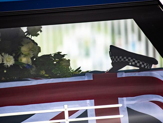 WARNING WARNING FAMILY HAS ASKED NOT TO BE PHOTOGRAPHED. IMAGES WERE TAKEN FROM THE STREET, Senior Constable Kevin King funeral as family carry the casket. Ð service to commenced at 1pm at the  Police Academy Ð 1 View Mount Road, Glen Waverley. Picture: Jason Edwards