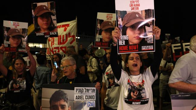 Relatives and supporters raise placards bearing portraits of Israeli hostages held in Gaza since the October 7 attacks by Hamas in southern Israel, during a rally calling for their release, outside the Prime Minister’s office in Jerusalem. Picture: AFP