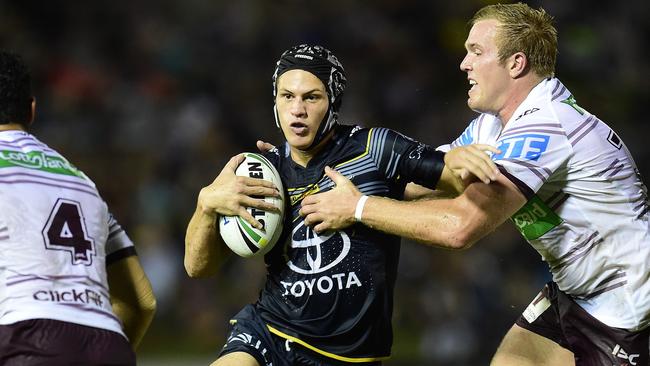 NRL Round 3. North Queensland Cowboy's Kalyn Ponga takes on Manly Sea Eagles Jake Trbojevic during the match at 1300 SMILES Stadium, Townsville, QLD. Picture: Wesley Monts