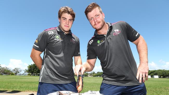 Queensland Reds Rugby Players Harry Hoopert (right) and Fraser McReight help out on the barbie as the Reds visited Gold Coast Eagles juniors at Southport. Photograph: Jason O'Brien