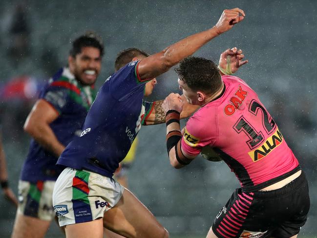 Chanel Harris-Tavita of the Warriors tackles Liam Martin of the Panthers during the round 14 NRL match between the New Zealand Warriors and the Penrith Panthers at Central Coast Stadium in Gosford. Picture: Getty