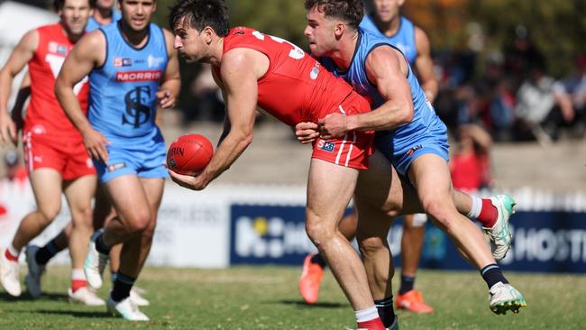 Sam Mayes from the Roosters is tackled by Will Snelling from Sturt during the Round 3 SANFL match between North Adelaide and Sturt at Prospect Oval in Adelaide, Saturday, April 20, 2024. (SANFL Image/David Mariuz)