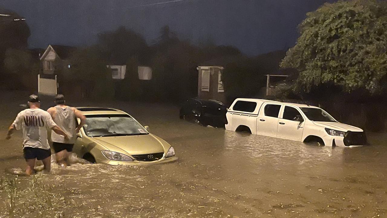 Cars and people underwater is Ballarat Rd, North Geelong, near the McKellar Centre. Picture: Wayne Buttner