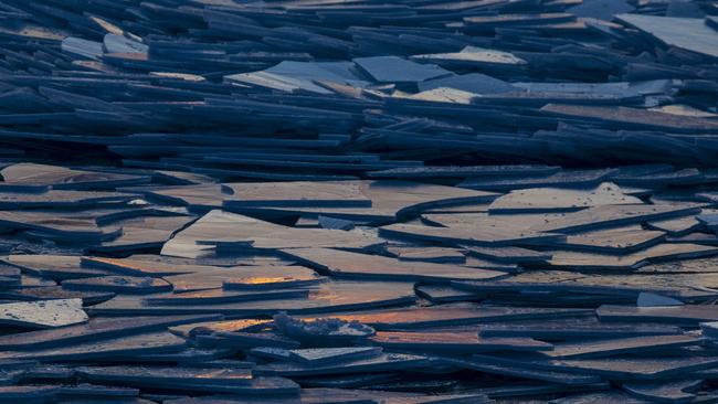 Shards of ice pile up because of the water moving underneath as the lake rapidly thaws. Picture: Joel Bissell/Kalamazoo Gazette via AP