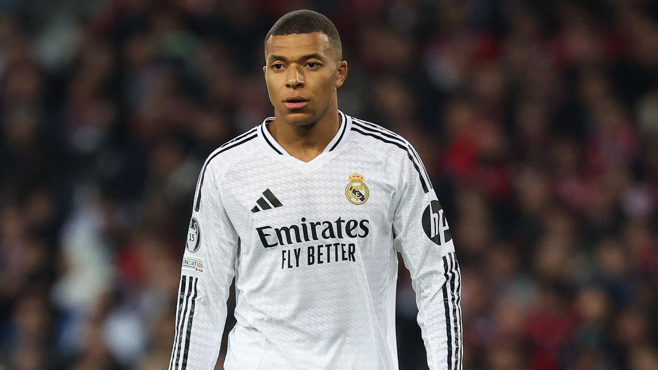 (FILES) Real Madrid's French forward #09 Kylian Mbappe looks on during the UEFA Champions League football match between Lille LOSC and Real Madrid at the Pierre Mauroy Stadium in Villeneuve-d'Ascq, northern France, on October 2, 2024. Kylian Mbappe is being investigated for rape by Swedish police, according to a newspaper report in Sweden following a visit by the Real Madrid star to Stockholm, which Mbappe denounced as "fake news". (Photo by FRANCK FIFE / AFP)