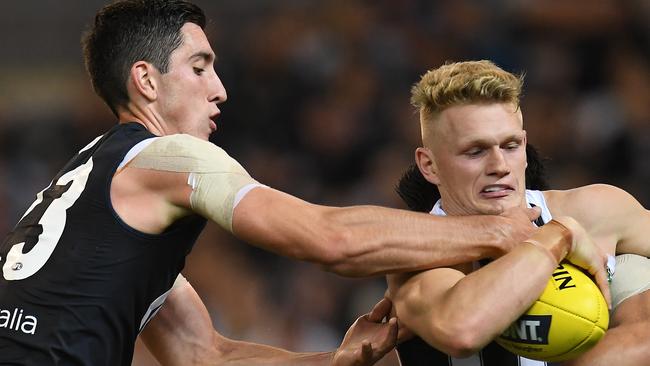 Mick Malthosue says Treloar has been ‘average’ but should play in the midfield. Pic: AAP