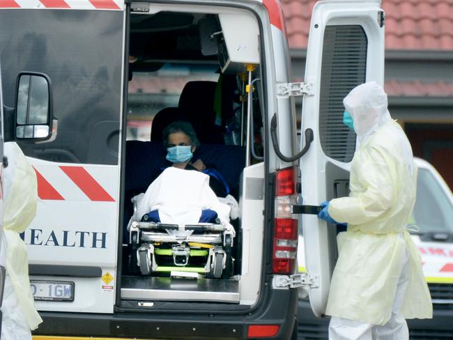 Medical staff remove patients from St Basil's Homes for the Aged at Fawkner. Picture: Andrew Henshaw/NCA NewsWire