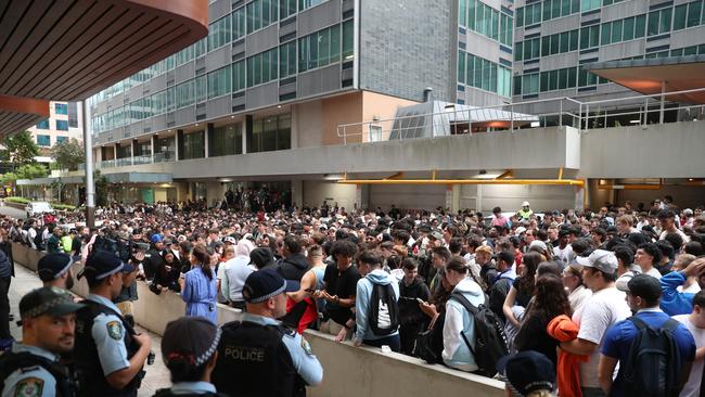 People crowd around the Chanel Nine studio in North Sydney, for free Prime Energy drink. Picture John Grainger