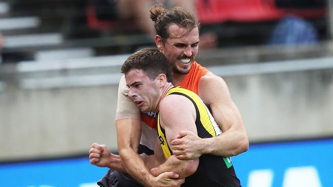 Phil Davis tackles Richmond’s Jack Higgins in Round 3. Picture: Phil Hillyard