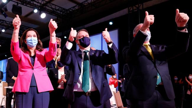 Then Queensland premier Annastacia Palaszczuk, Brisbane lord mayor Adrian Schrinner and then federal sports minister Richard Colbeck celebrate after Brisbane was announced as the 2032 Summer Olympics host city in July 2021 during the Covid pandemic. Picture Toru Hanai.