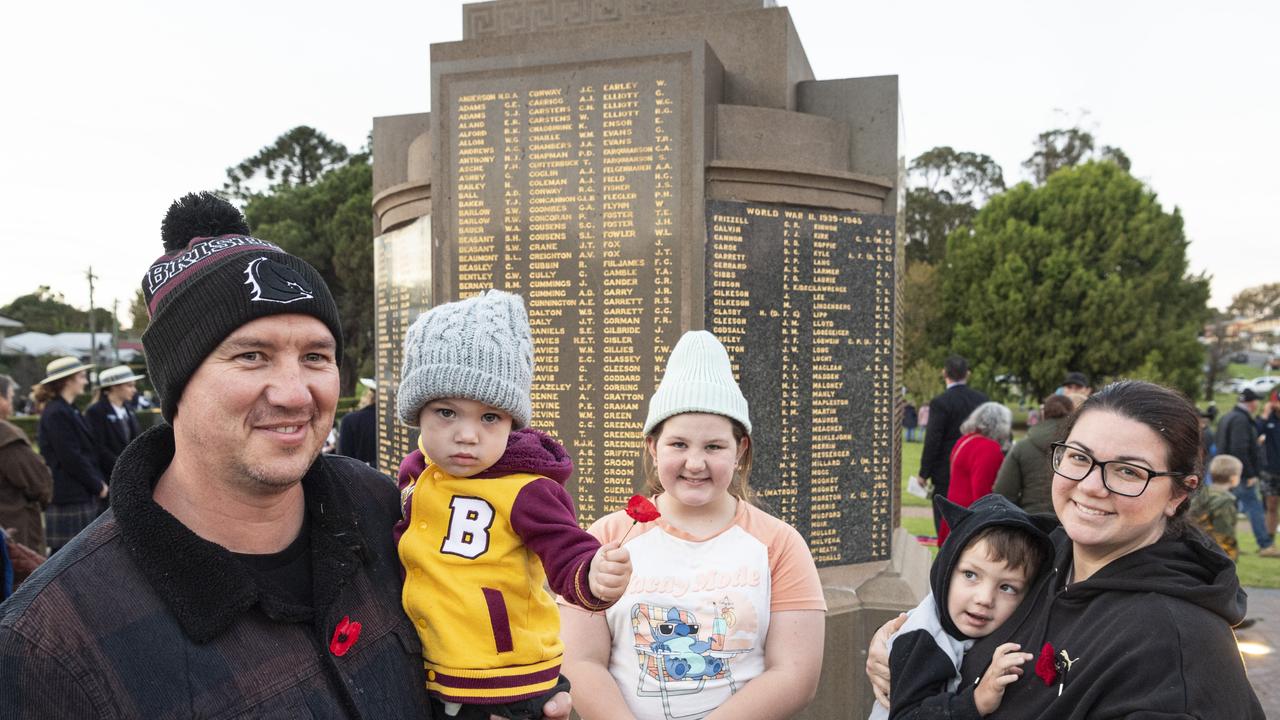 Laying poppies after Toowoomba's Anzac Day Dawn Service are (from left) Rohan, Dominic, Eva, Owen and Jade Edwards at the Mothers' Memorial, Thursday, April 25, 2024. Picture: Kevin Farmer