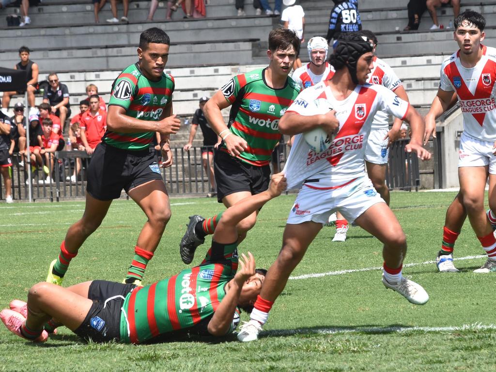 Jasais Ah Kee tries to get through the tackle of Taj Aufai-Farani. Picture: Sean Teuma