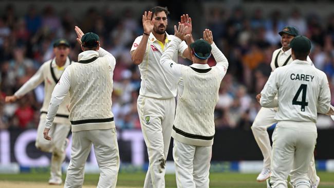 Australia celebrate the wicket of Jonny Bairstow - with a little sledge on the way back. Picture: AFP