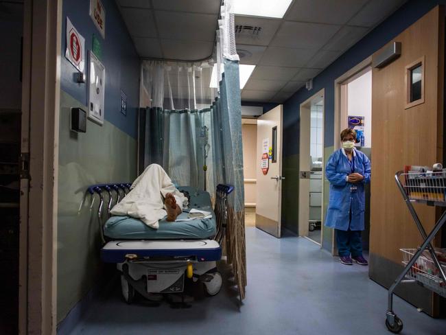 A patient rests in a corridor waiting for a room in a Californian hospital. Picture: AFP