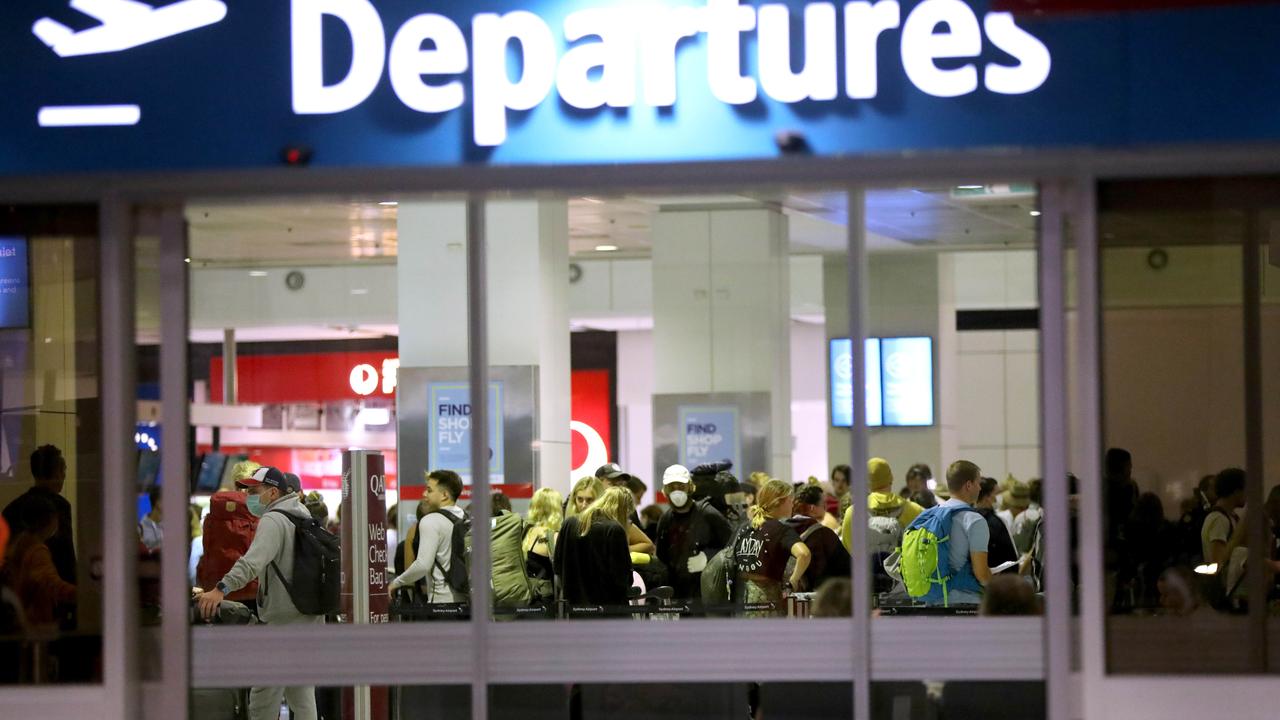 People crowded Sydney’s international departures back in March as the lockdown saw many visitors heading home. Picture: Damian Shaw