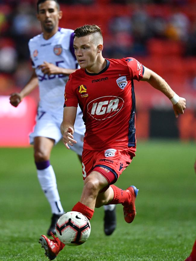 Scott Galloway was helpless to prevent Perth Glory’s opening goal deflecting in off him during Adelaide United’s Hindmarsh Stadium defeat. Picture: AAP Image/David Mariuz