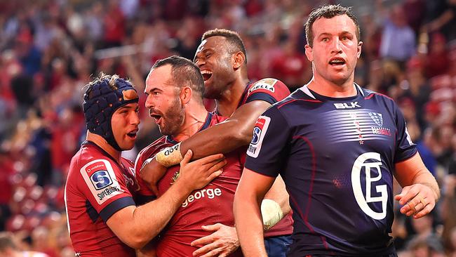 Jono Lance celebrates with teammates after scoring against the Rebels at Suncorp Stadium on Friday night. Pic: AAP