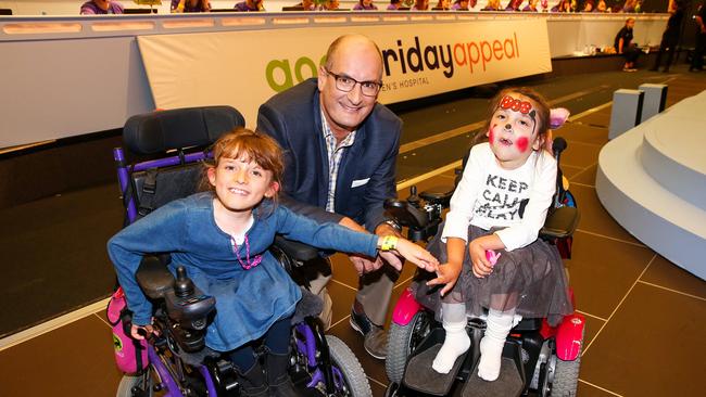 Kochie helping out in 2016, with Chloe O’Neill (left) and Simone Lionetti. Picture: Ian Currie