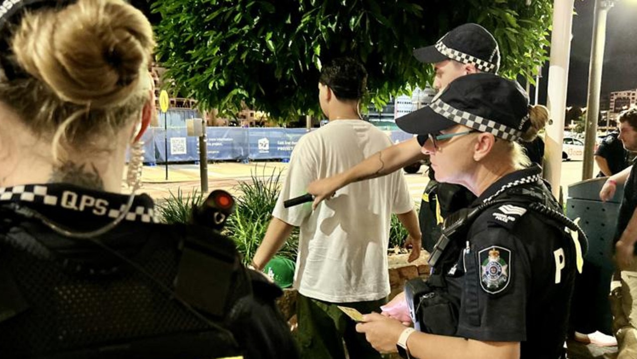 Police on Flinders St, Townsville 'wanding' revellers for knives. Picture: Natasha Emeck