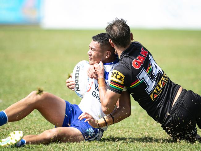 Tawa-Dean Simpkins is tackled by Cameron Bamblett. Picture: Julian Andrews