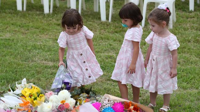 BRISBANE, AUSTRALIA - FEBRUARY 23: Mourners lay flowers during a vigil to remember murdered mother, Hannah Clarke and her three children at Bill Hewitt Reserve in Camp Hill on February 23, 2020 in Brisbane, Australia.  Hannah Clarke, and her children Aaliyah, 6, Laianah, 4, and Trey, 3, were killed by Rowan Baxter after he doused them in petrol and set their car alight. Baxter stabbed himself and died shortly after. (Photo by Jono Searle/Getty Images)