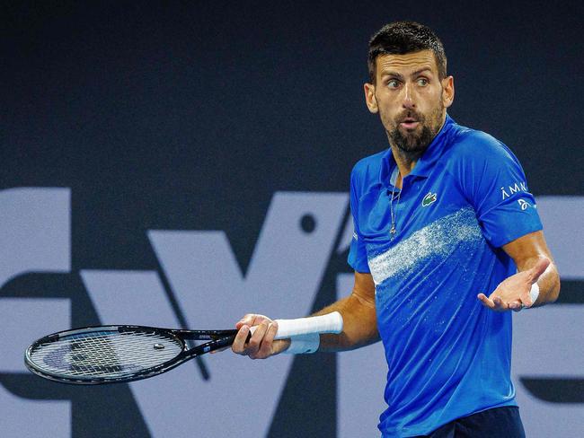 Serbia's Novak Djokovic reacts during his men's singles quarter-final match against USA's Reilly Opelka at the Brisbane International tennis tournament in Brisbane on January 3, 2025. (Photo by Patrick HAMILTON / AFP) / --IMAGE RESTRICTED TO EDITORIAL USE - STRICTLY NO COMMERCIAL USE--