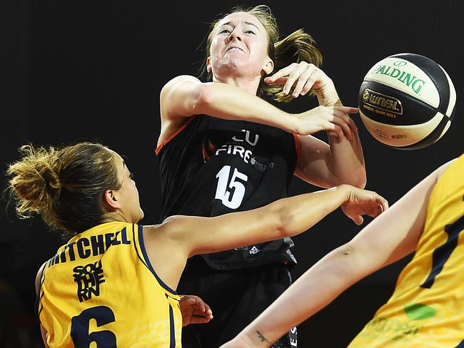 Fire's Amy Kame guarded by Flames star Leilani Mitchell in the second semi-final.