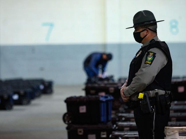 A trooper watches over ballots at the Allegheny County elections warehouse in Pittsburgh, Pennsylvania. Picture: AFP