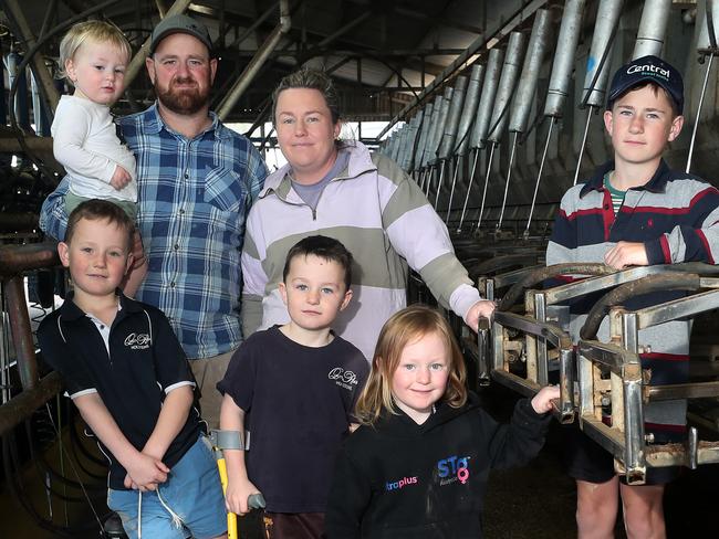 Dairy farmer Jayke Fisher, with his wife Bec, children: Cooper, 12, Max, 8, Harry, 7, (crutches), Ava, 5, Lewy, 2, dog - Allie,  Kyabram, Picture Yuri Kouzmin
