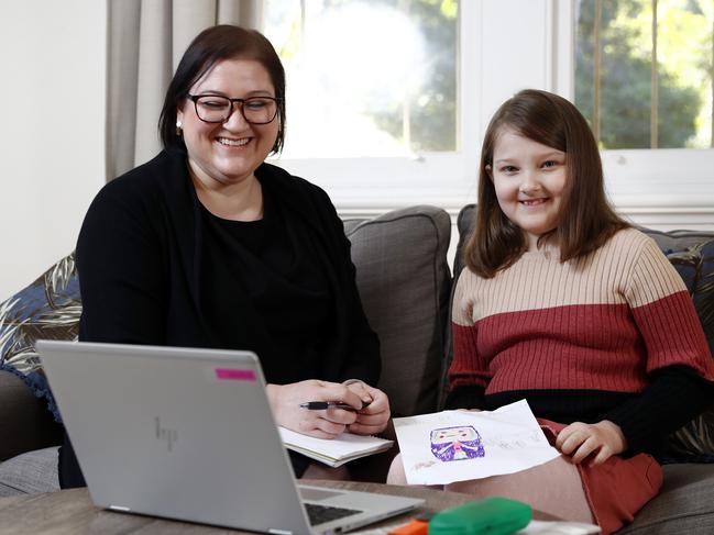 Joanne Gartside with her daughter Isobel Mandin at their Denistone home during a Zoom conference call with Isobel's Year 3 teacher. Picture: Sam Ruttyn