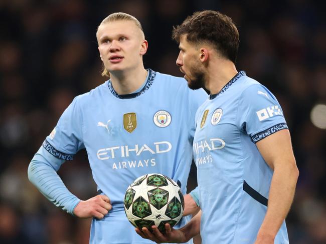 Erling Haaland and Ruben Dias after one of Real Madrid’s late goals.