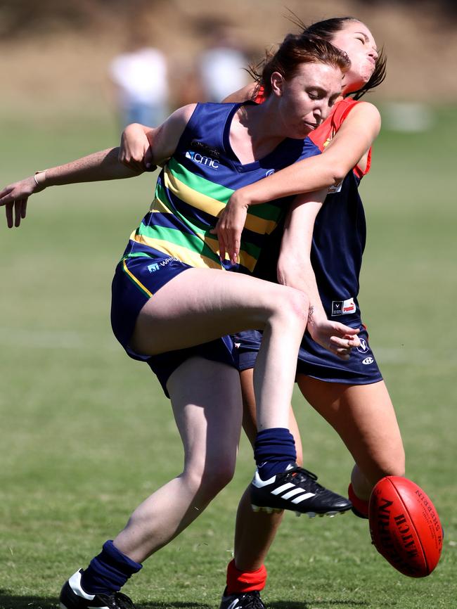 Loren Pugh of St Kevins gets a kick away during a VAFA Women’s match against Old Brighton. Picture: Mark Dadswell