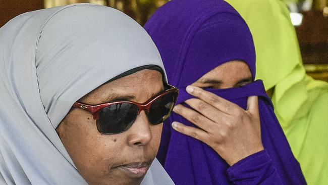 Abdirahman Khalif, in purple, leaves court following her acquittal on October 31, 2019.