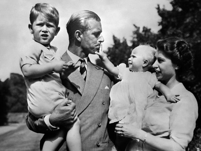 Britain's Queen Elizabeth II (R) and her husband Prince Philip, Duke of Edinburgh (L) walk with their children, Prince Charles, Prince of Wales (L) and Princess Anne (R). Picture: AFP