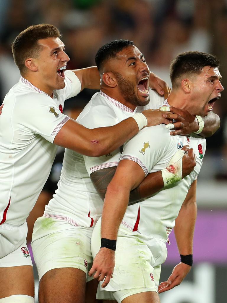 England players celebrate a try against New Zealand.