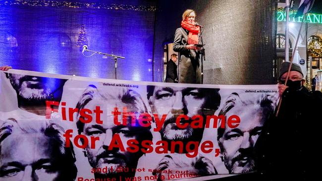 A banner in support of Julian Assange is seen in front of the stage where the Norwegian Minister of Culture Anette Trettebergstuen speaks before a procession in honor of this year's Nobel Prize winners, Philippine Maria Ressa and Russian Dmitry Muratov. Picture: AFP