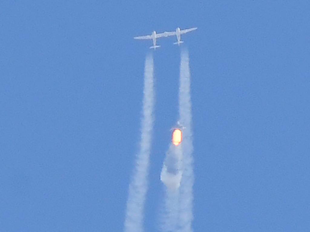 The Virgin Galactic SpaceShipTwo space plane Unity and mothership separate as they fly way above Spaceport America, near Truth and Consequences, New Mexico. Picture: AFP