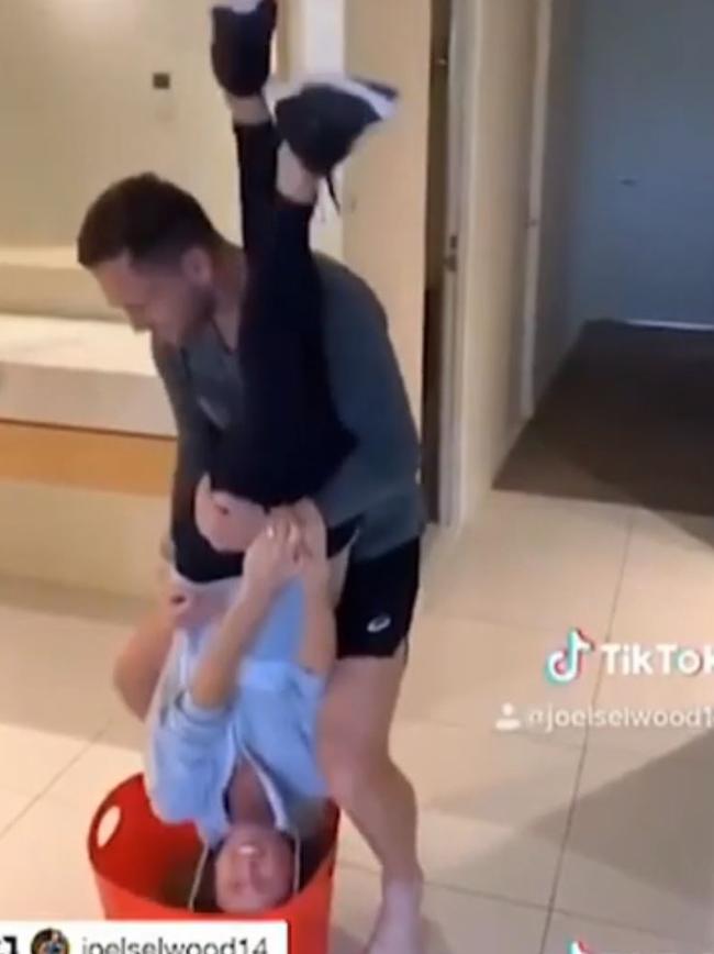 Joel Selwood using wife Brit as a mop during a Tiktok clip