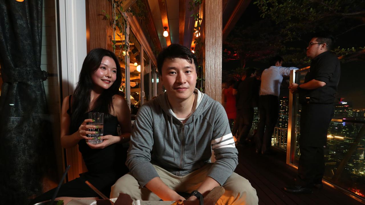 Mr Wang and Ms Ding enjoying Singapore’s nightlife. Picture: Vanessa Hunter