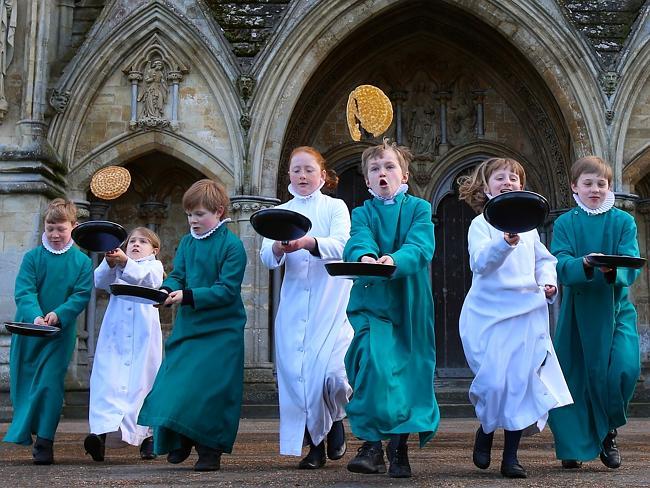 Trainee choristers at Salisbury Cathedral Choir flip pancakes to mark Shrove Tuesday.