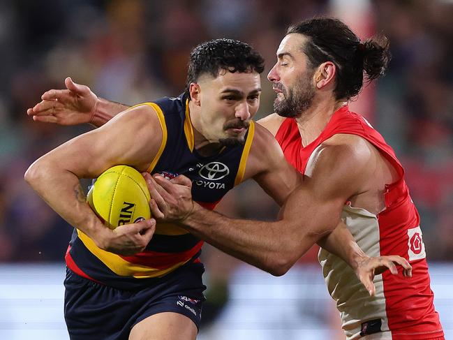 ADELAIDE, AUSTRALIA - JUNE 15: Izak Rankine of the Crows and Brodie Grundy of the Swans during the 2024 AFL Round 14 match between the Adelaide Crows and the Sydney Swans at Adelaide Oval on June 15, 2024 in Adelaide, Australia. (Photo by Sarah Reed/AFL Photos via Getty Images)