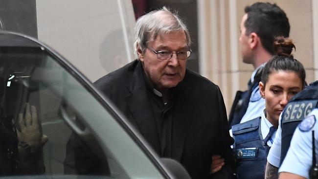 Cardinal George Pell arrives at the Supreme Court of Victoria for day two.