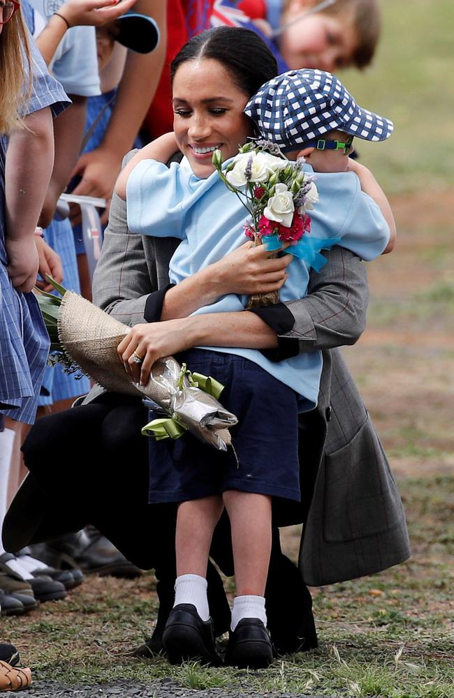 Luke then embraced Meghan and gave her a bunch of flowers. Picture: Phil Noble