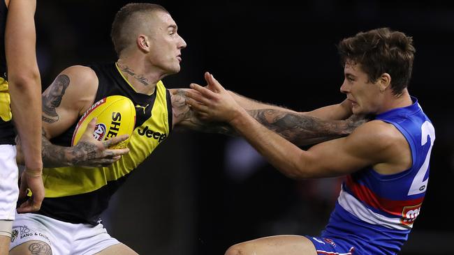 Dustin Martin pushes Josh Dunkley out of the way in Round 7. Picture: Michael Klein