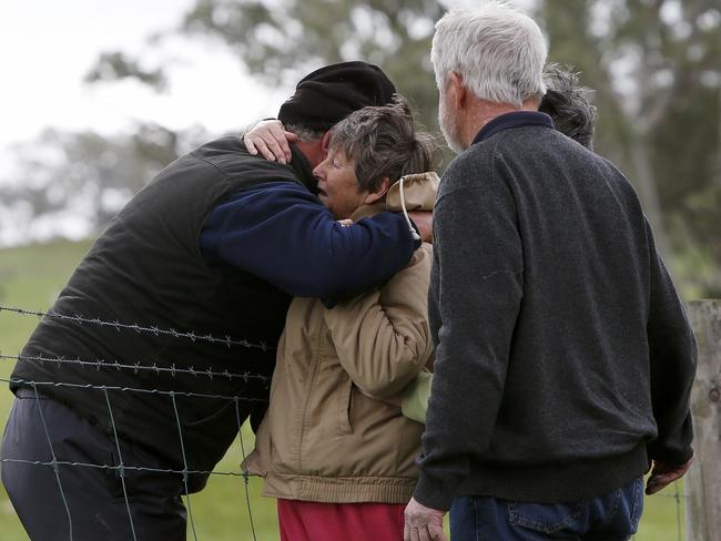 Yvonne Fox being consoled by friends. Picture: Simon Cross