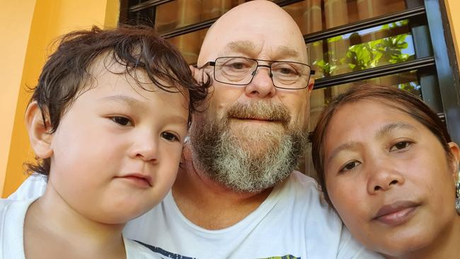 Hobart man Brett Riseley with wife Imelda and three-year-old son Tasman. They are stuck in the Philippines and unable to return to Tasmania because of coronavirus restrictions.